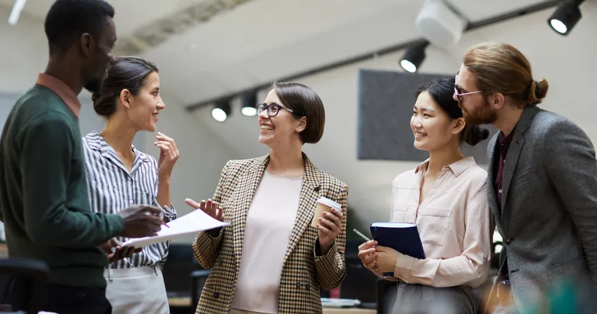 Interdepartmental Communication image featuring coworkers talking