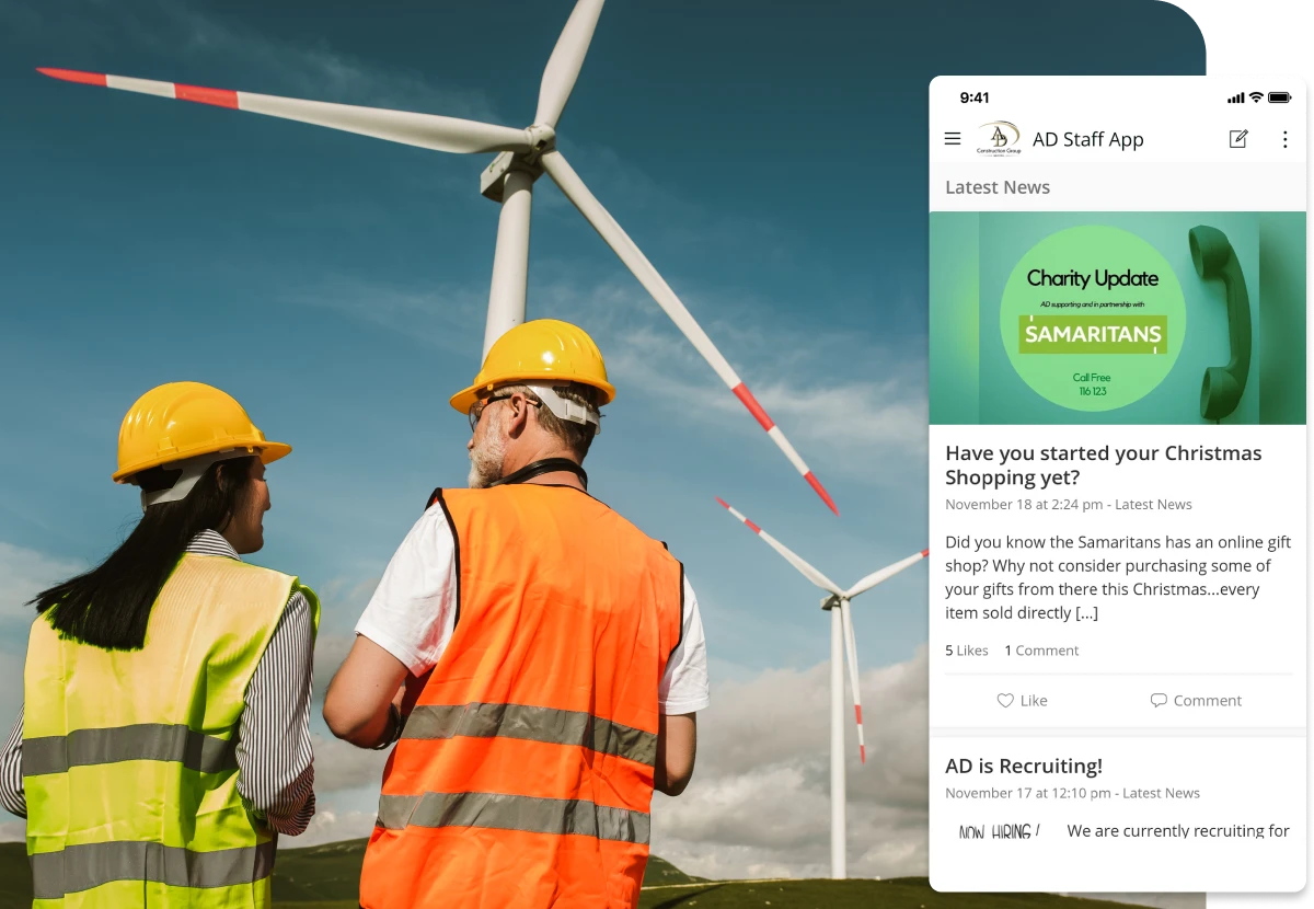 Two workers in safety gear stand near wind turbines. A smartphone displays an app with news and updates.