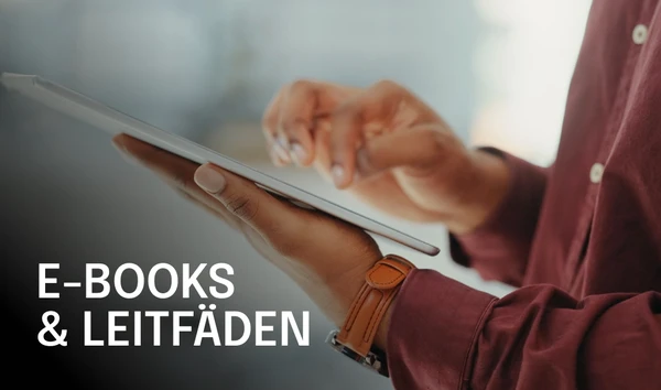 Person using a tablet with "Digital Resources" text overlay, wearing a maroon shirt and brown watch. Blurred background.